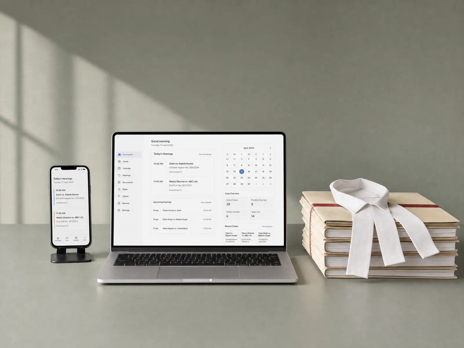 A laptop with a legal practice dashboard, a phone with today's hearings, and case files with an advocate's band